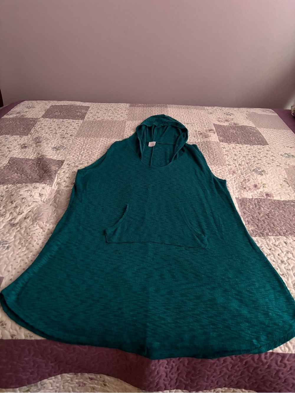 Sleeveless Hooded swimsuit cover in green.